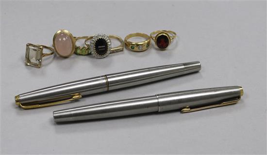 Two Parker pens with 14ct gold nibs and seven assorted gem set rings, including 9ct and 18ct.